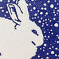 greetings card of a white rabbit under a dark sky in the snow, close up of the card
