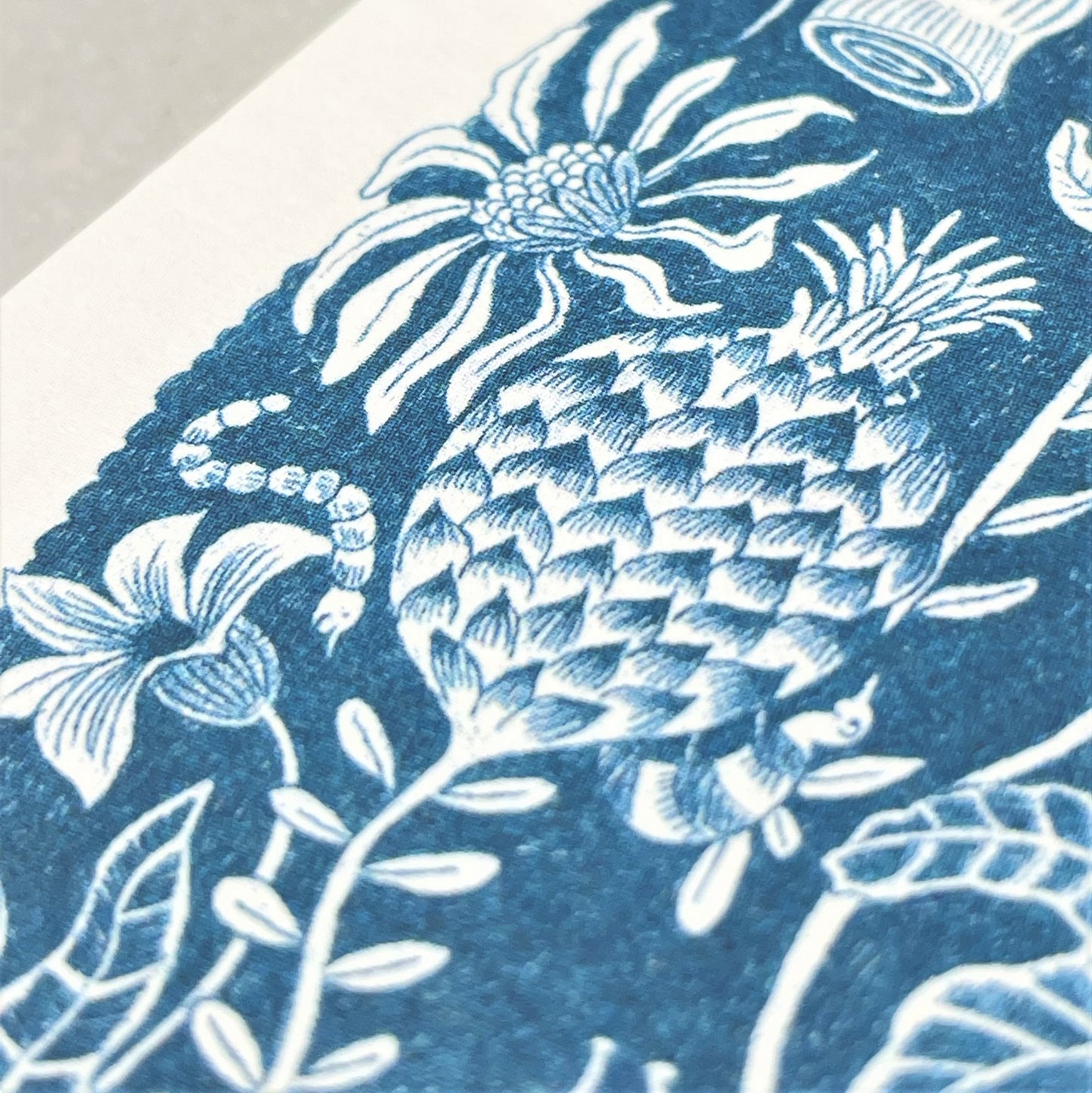 greetings card with a botanical wonderland theme in blue, close up of the card