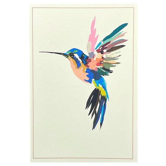 greetings card of a colourful humming bird in flight by Com Bossa Studio
