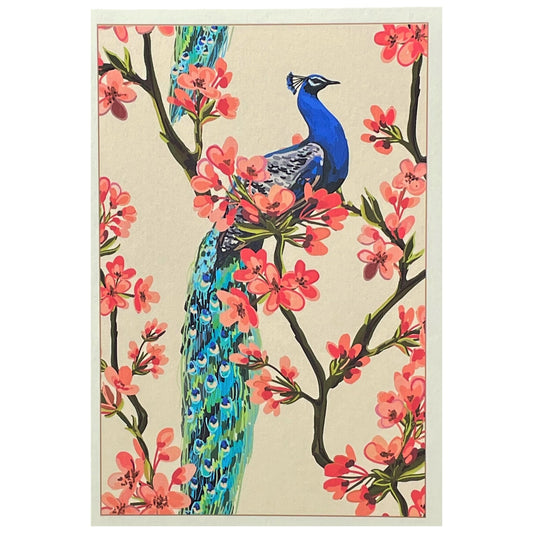 greetings card of a peacock on a branch of a tree in blossom by Com Bossa Studio