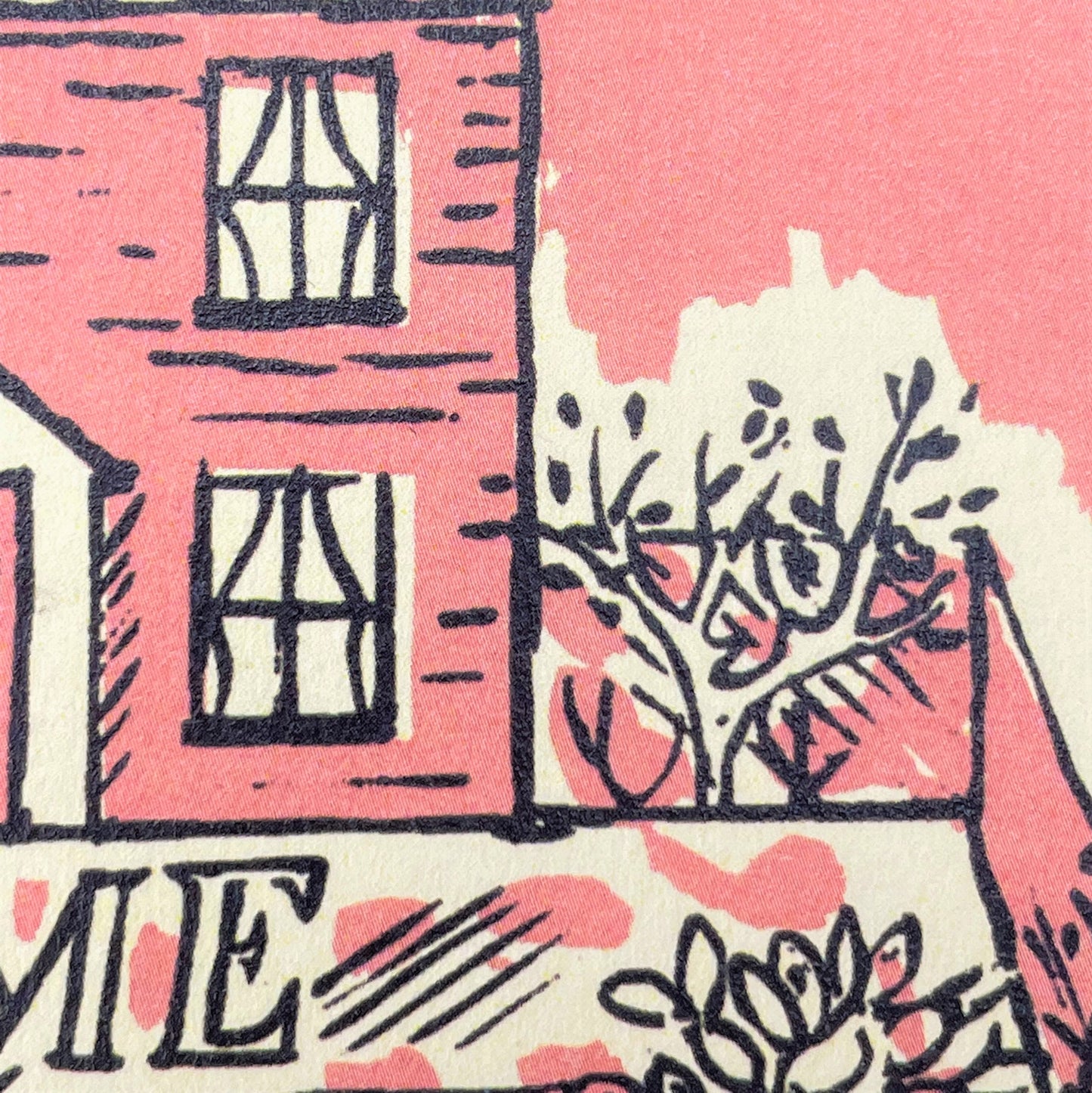 greetings card of a pink house and garden and the words home sweet home, close up of the pink house