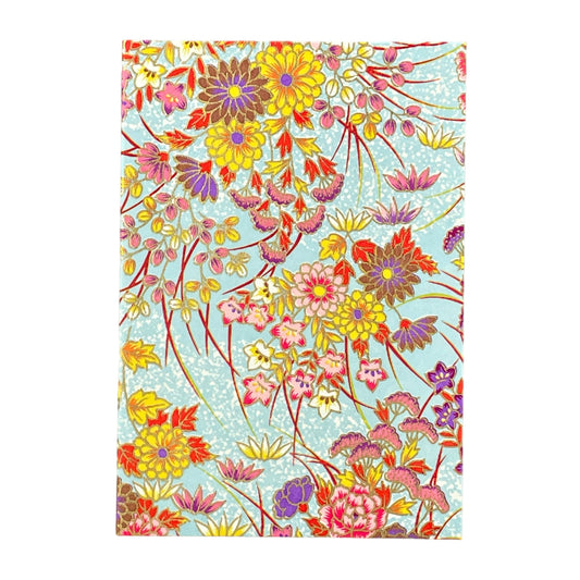 japanese silk-screen printed greetings card with bright floral pattern on a pale blue backdrop by Esmie