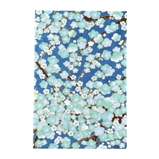 japanese silk-screen printed greetings card with a pattern of pale blue and white blossom on a blue backdrop by Esmie