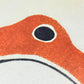 greetings card of a japanese frog coloured orange, close up of the frog's eye