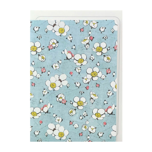 greetings card with a repeat pattern of plum blossom on pale blue backdrop by Ezen Design