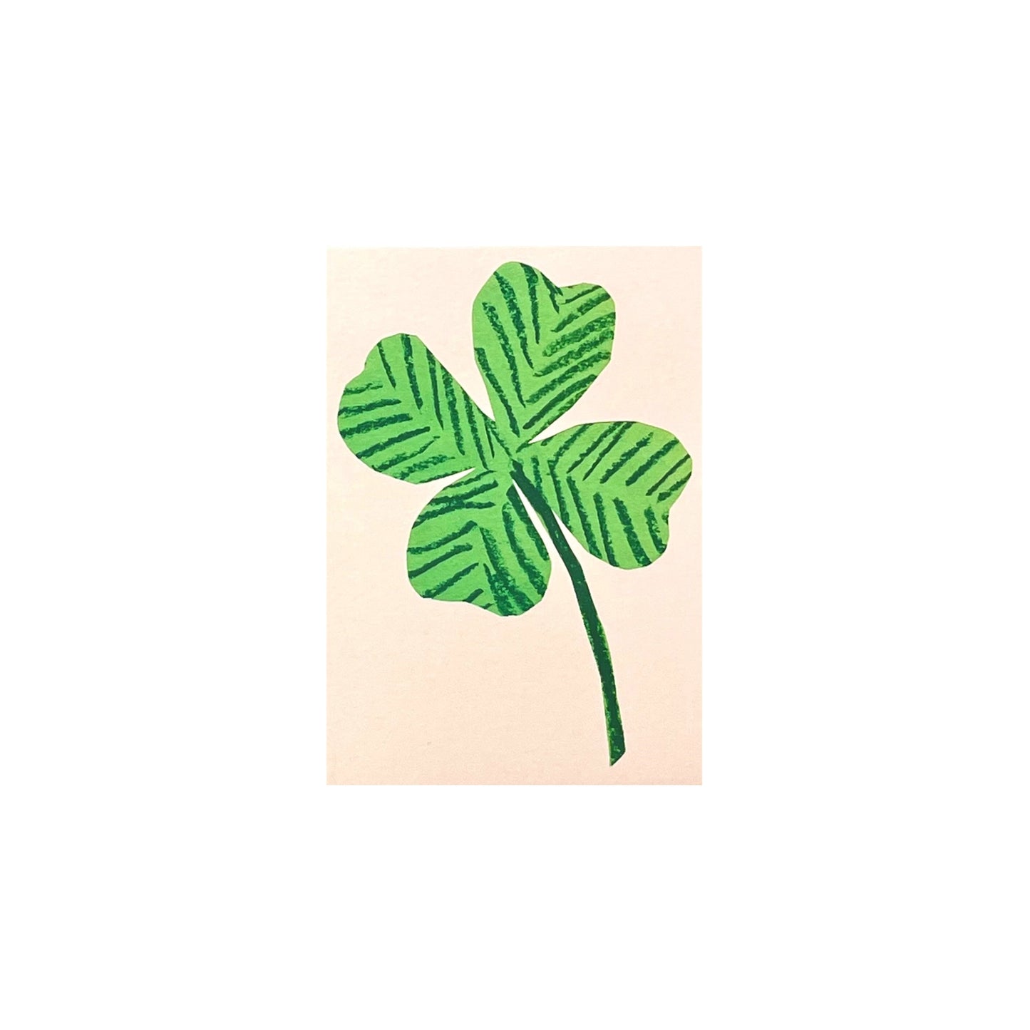 small greetings card with a green four leaf clover on pink background, by Hadley Paper Goods