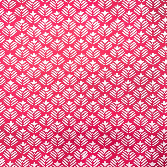 wrapping paper with magenta backdrop and a white flower repeat pattern by Heather Evelyn