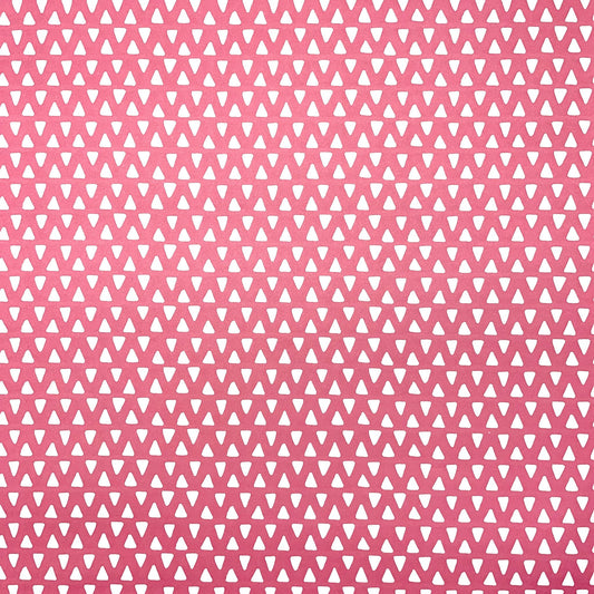 wrapping paper with pink background and repeat pattern of little white triangles by Heather Evelyn