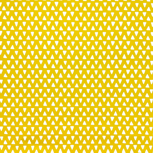 wrapping paper with yellow background and repeat pattern of little white triangles by Heather Evelyn