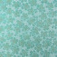 japanese silk-screen paper, chiyogami, with a cherry blossom flower repeat pattern in turquoise and white