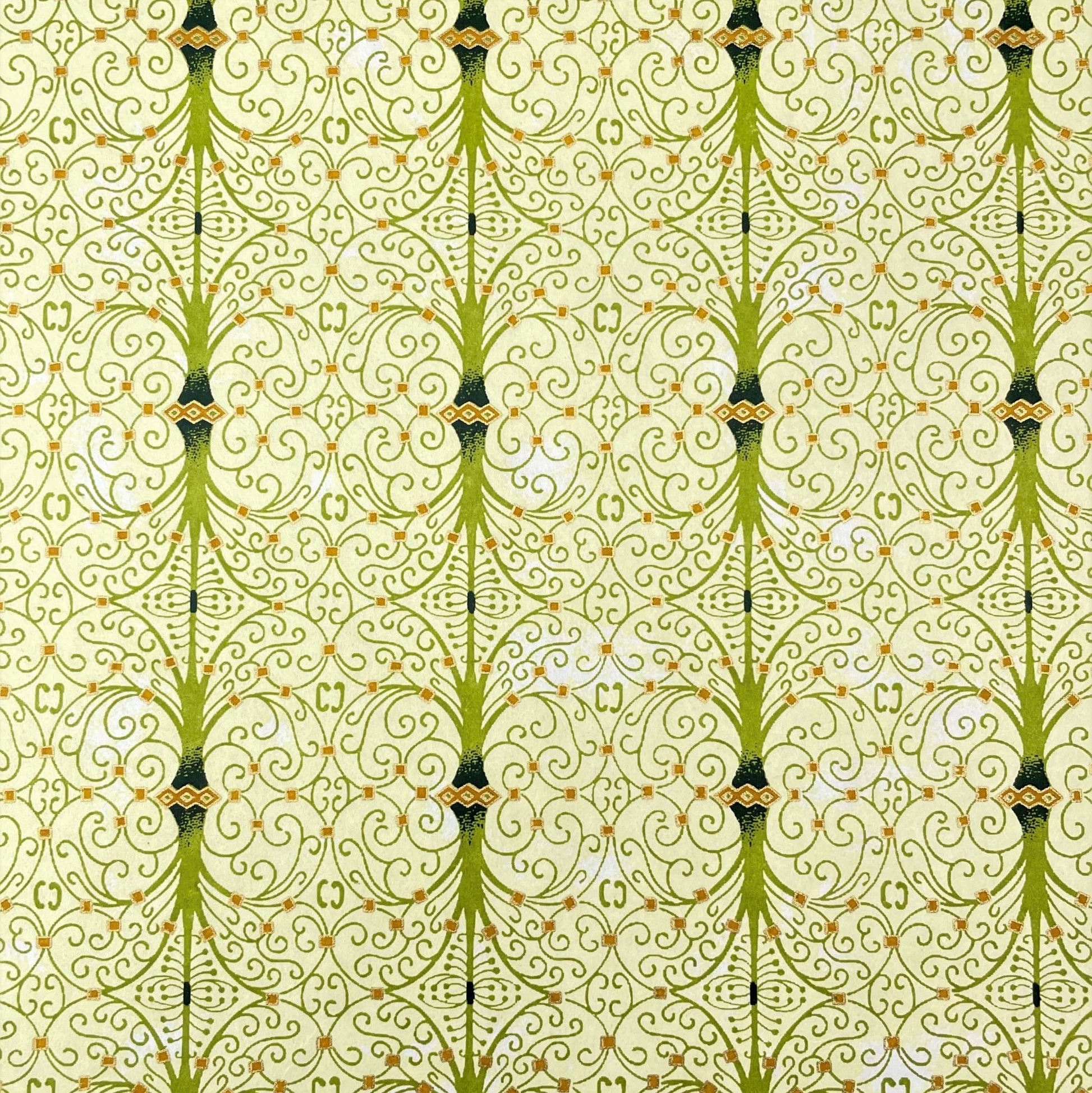 japanese silk-screen handmade paper showing green filigree pattern with gold accents