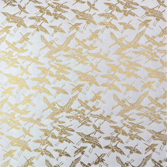japanese silk-screen handmade paper showing gold cranes in flight on ivory backdrop