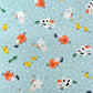 japanese silk-screen handmade paper showing spring animals motifs on a light blue backdrop