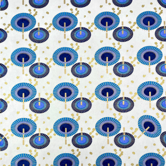 japanese silk-screen handmade paper showing a repeat pattern of blue umbrellas with gold highlights
