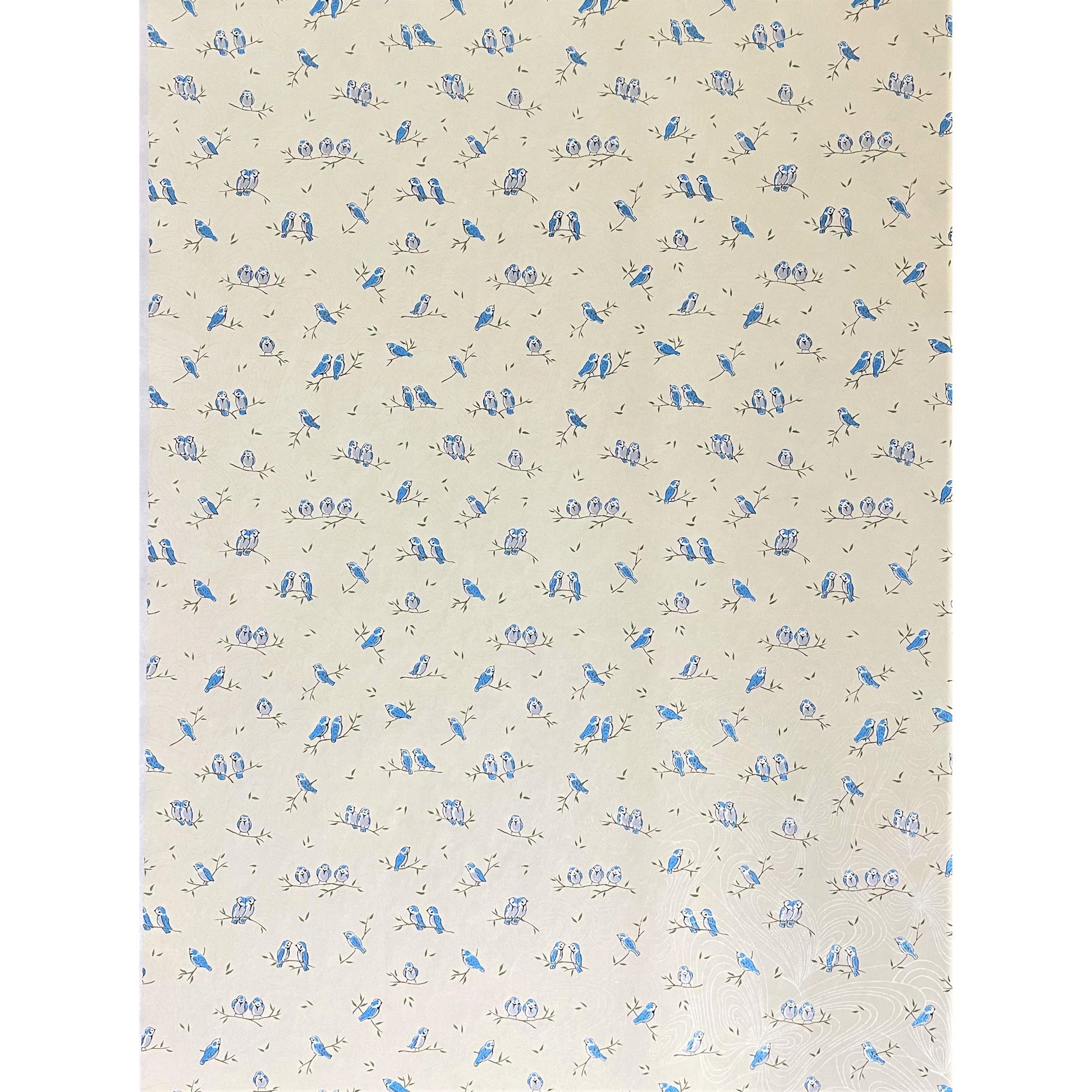 japanese silk-screen handmade paper showing blue birds on branches, the backdrop is cream with opalescent butterflies, full sheet view