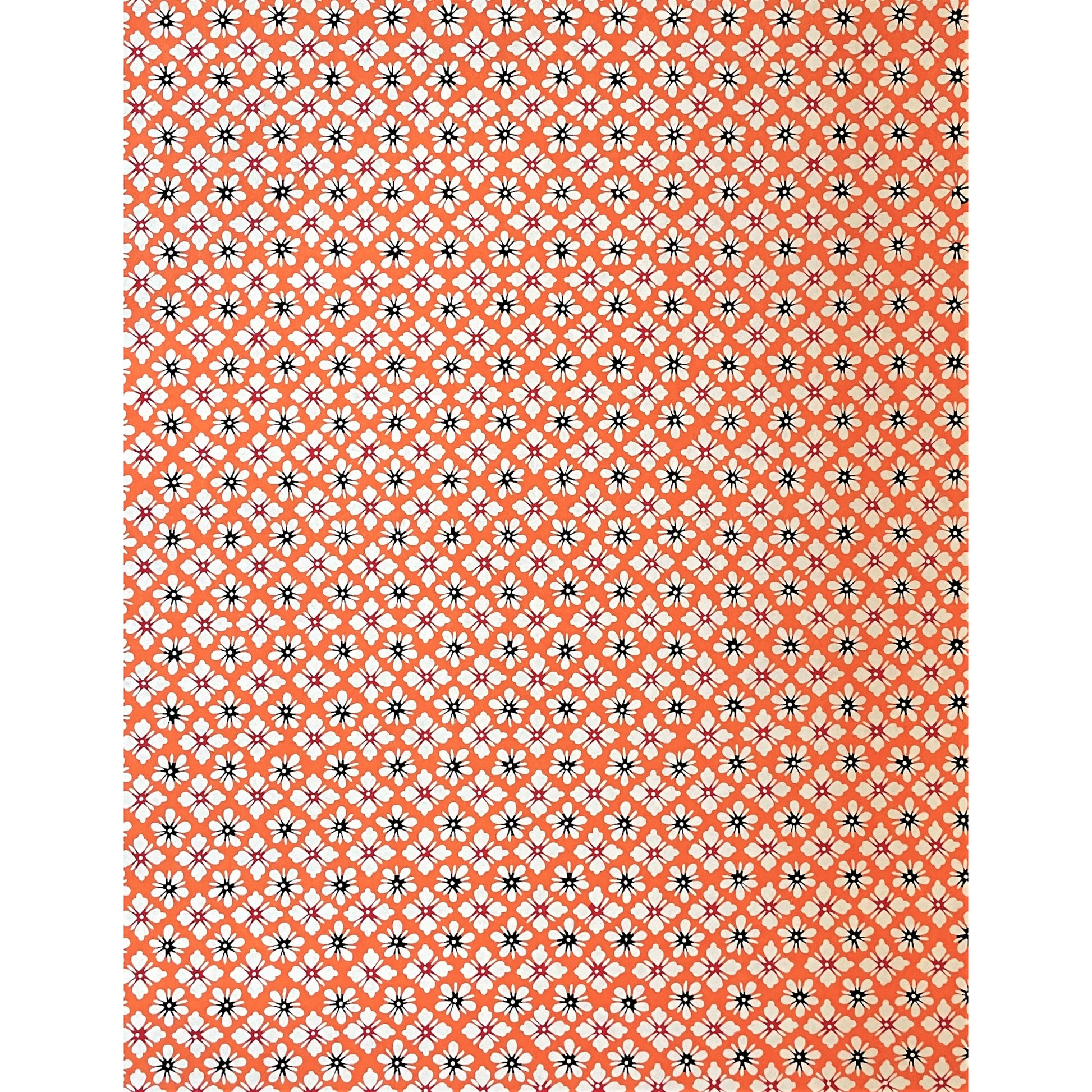 japanese stencil-dyed handmade paper with small scale floral repeat in orange and cream, full sheet view