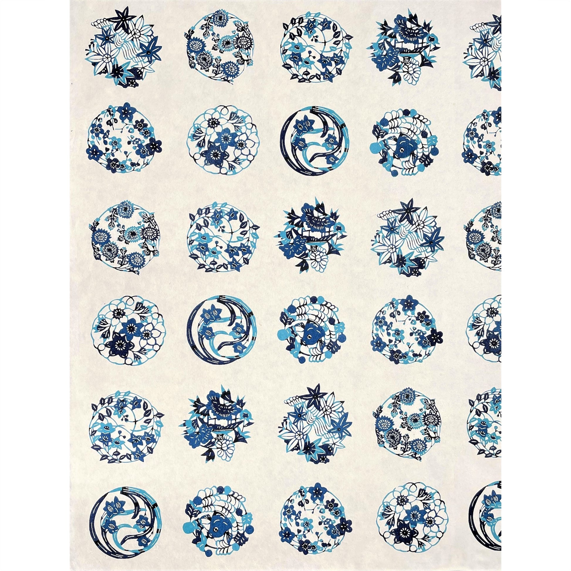 japanese stencil-dyed handmade paper with traditional blue botanical circles pattern on ivory backdrop, full sheet view