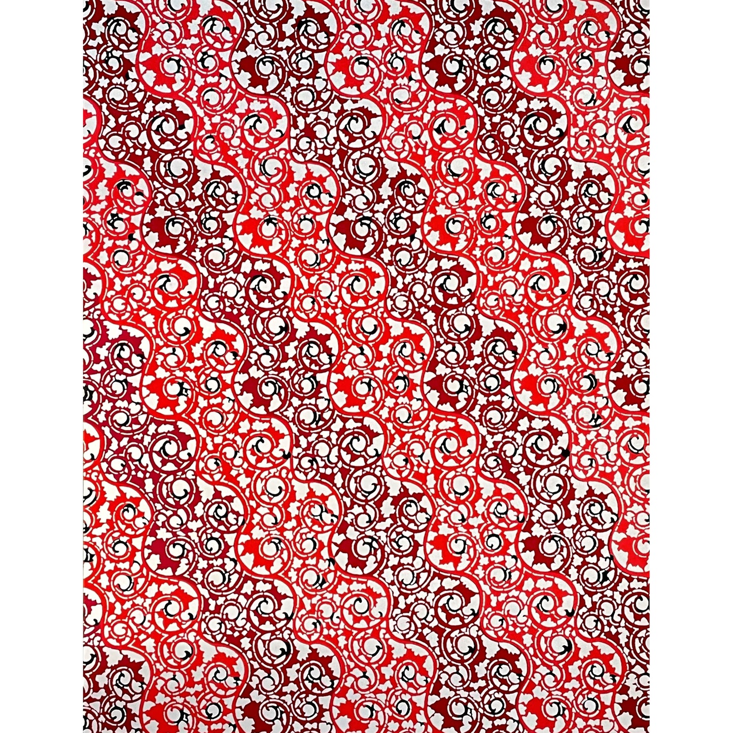 japanese stencil-dyed handmade paper with traditional arabesque vine pattern in red and maroon, full size sheet