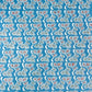 japanese stencil-dyed handmade paper with bonsai tree repeat pattern on blue backdrop
