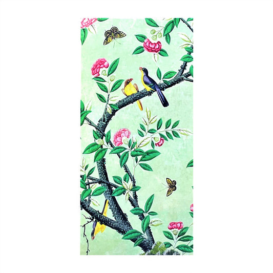 greetings card with pale green background and two birds on a branch of a tree in blossom