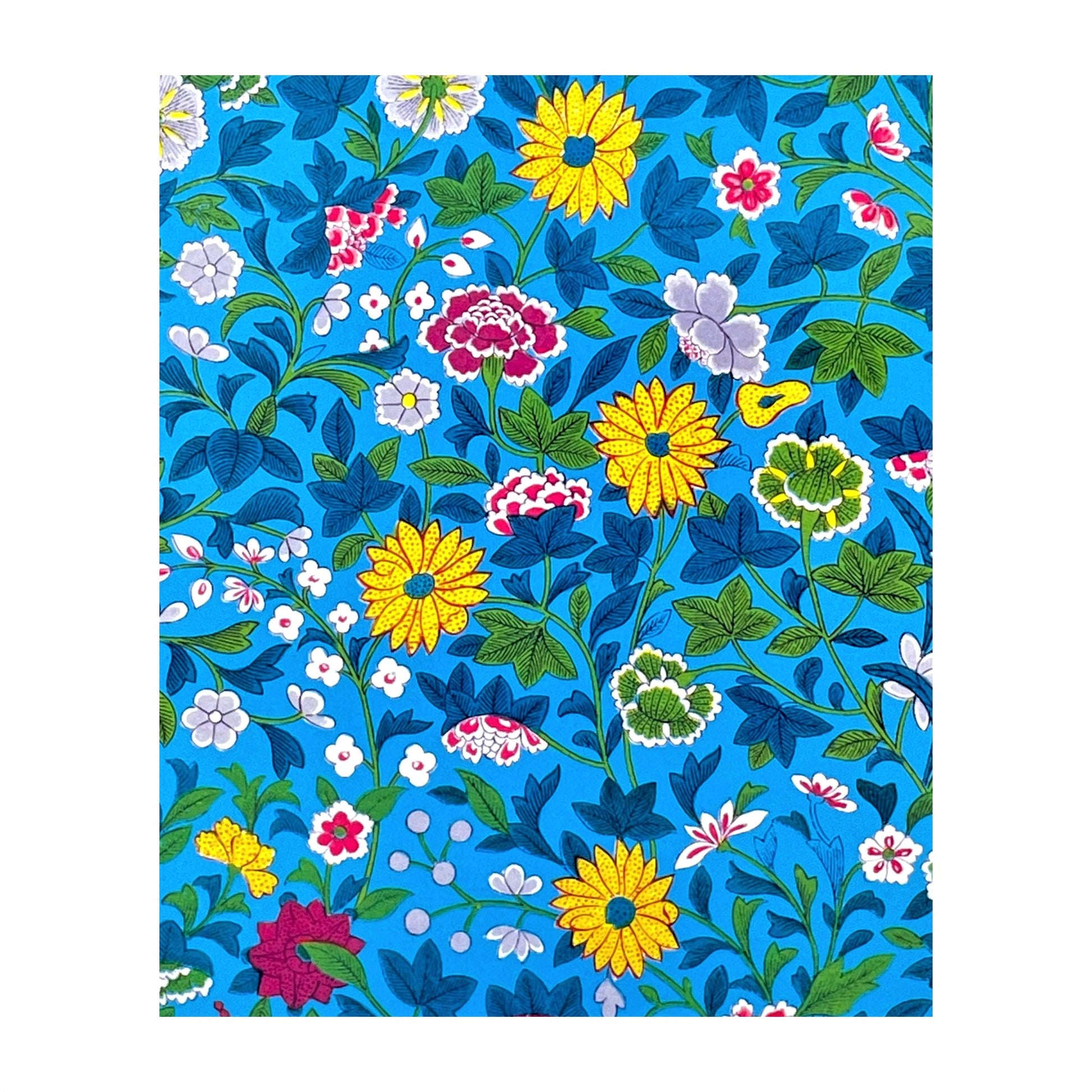 greetings card showing a floral repeat pattern on a blue background