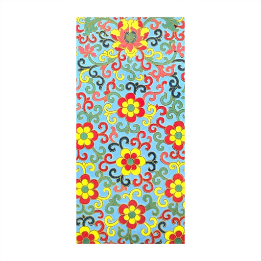 greetings card showing a floral repeat pattern in yellow and red on an aqua backdrop