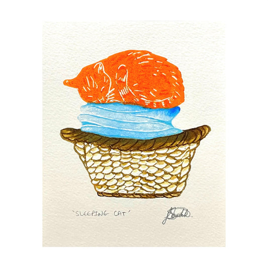 greetings card showing an orange cat sleeping in a laundry basket