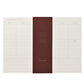 Weekly planner desk pad, ivory sheets with daily lined columns and a space for notes, pictured with burgundy branded belly band
