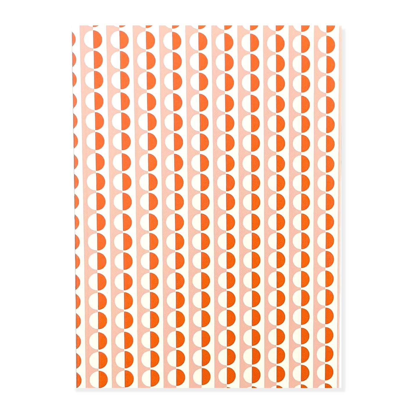 A5 softback notebook with geometric orange and pink repeat circle patterned cover. Plain inner pages