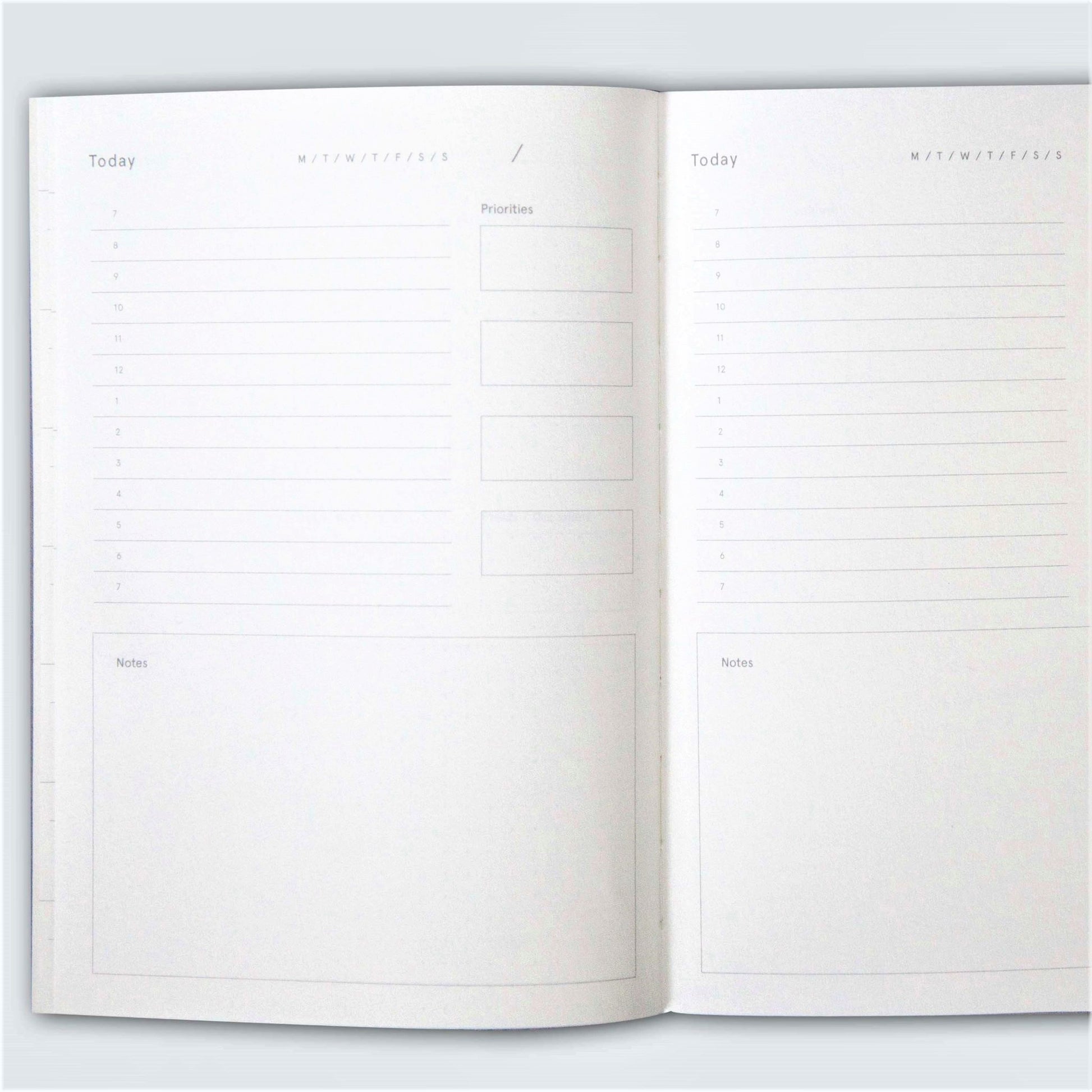 A5 softback 12 week daily planner, pictured open to show the daily planner layout