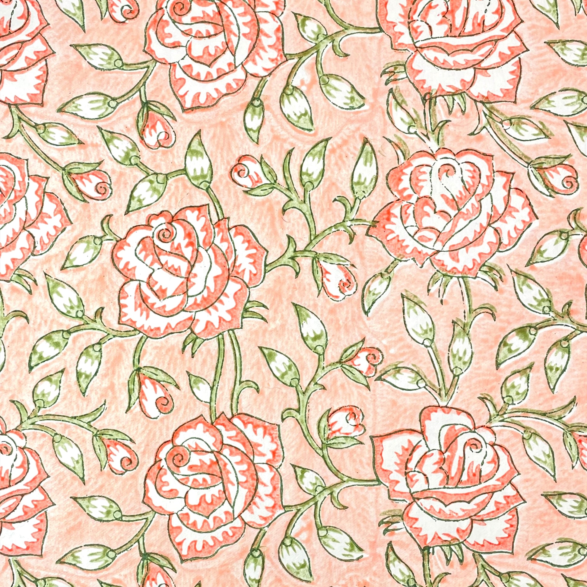 wrapping paper with repeat botanical rose pattern in coral and green by Paper Mirchi