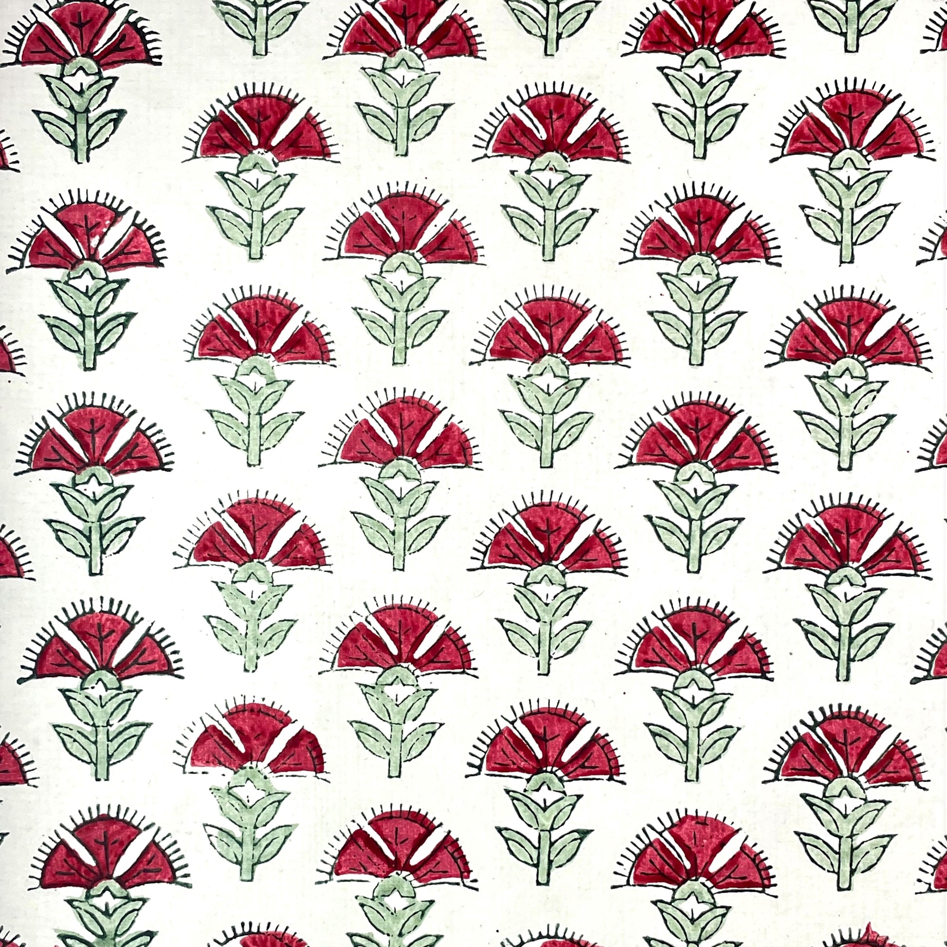 wrapping paper with repeat block-print thistle pattern in dark pink and green by Paper Mirchi
