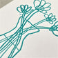 letterpress greetings card of a drawing of four vases of flowers, teal ink on white, close-up