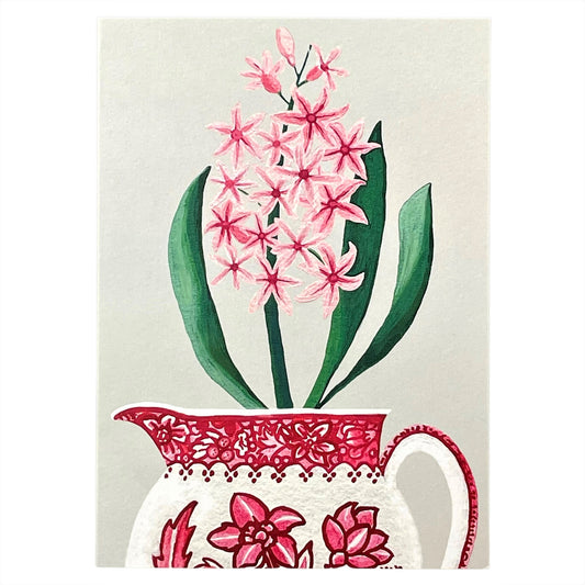greeting card of a painting of a pink hyacinth in a red and cream jug with a hellebore flower design by Susie Hamilton