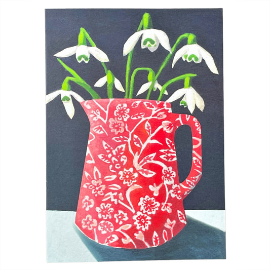 greeting card of a painting of white snowdrops in a red and white patterned jug, dark grey background by Susie Hamilton
